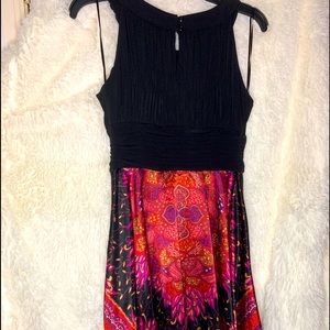 Sleeveless dress sz 10 knee length, A-line.  Sangria, pink, pattern w/black top